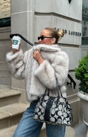 Beginning Boutique It Girl Sand Faux Fur Jacket sand faux fur jacket with a wide collar and long sleeves