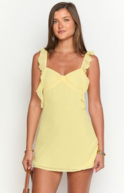 Yellow chiffon mini dress with ruffled shoulder straps and a gathered detail at the sweetheart neckline