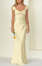 Front view of a yellow satin maxi dress featuring a ruched sweetheart neckline and draped off-shoulder cap sleeves