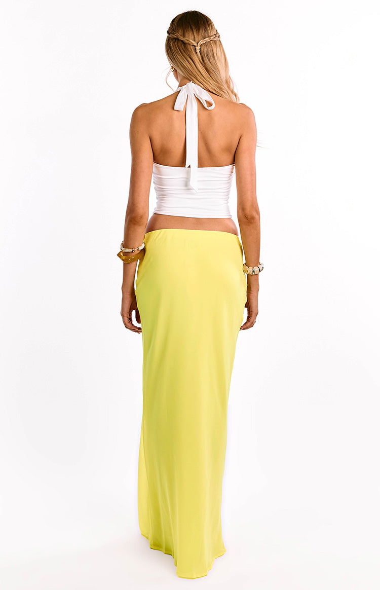 Rear view of a bright yellow maxi skirt with a smooth, flowy drape and elasticated waist