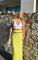 Light yellow fitted maxi skirt showing its full length and flowing drape
