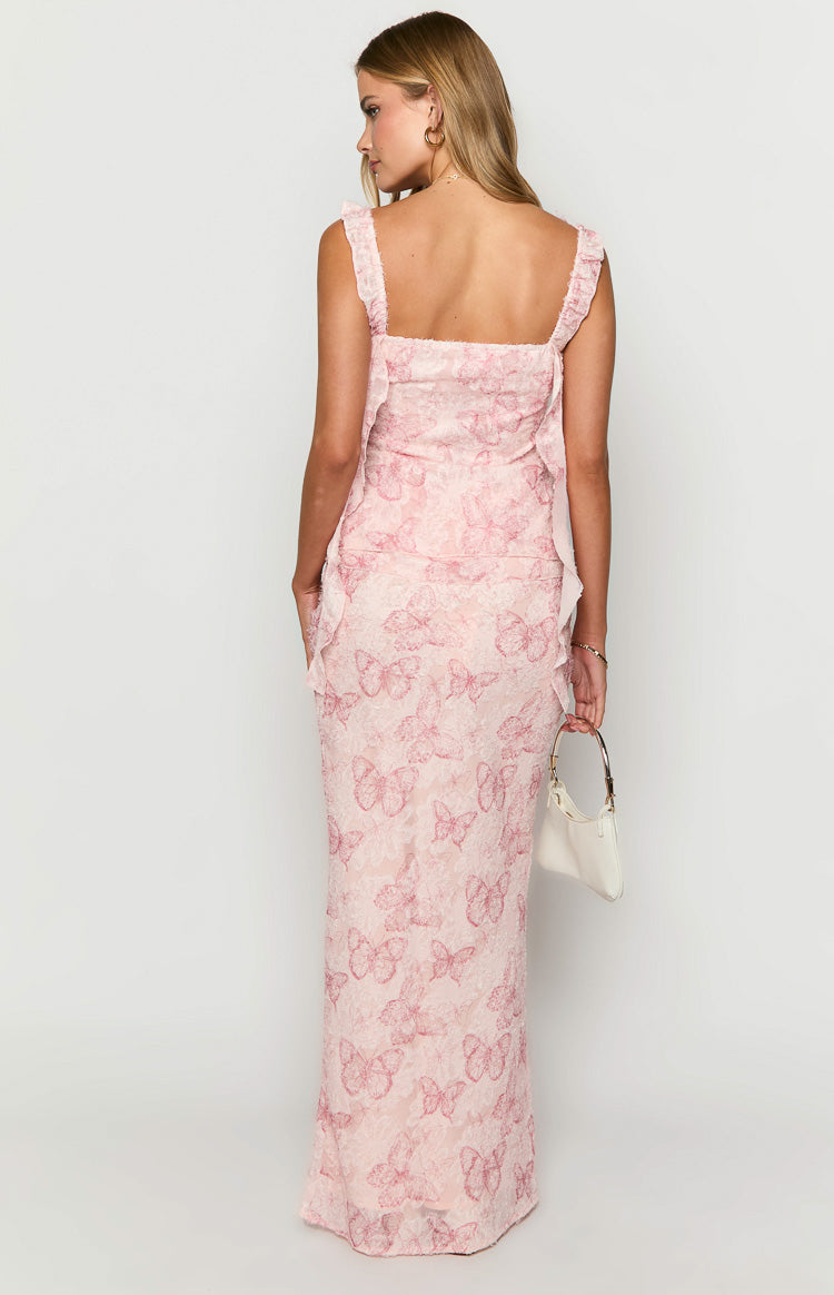 Rear view of a pink maxi skirt with an all-over textured butterfly pattern and fitted silhouette