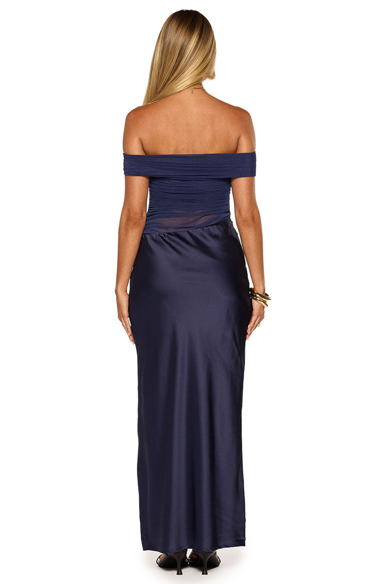 Rear view of a navy off-shoulder maxi dress with a ruched bodice and sheer waist panel