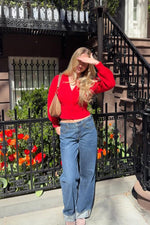 Beginning Boutique Janda Red Knit Oversized Cardigan red knit oversized V-neck button front cardigan with long puff sleeves