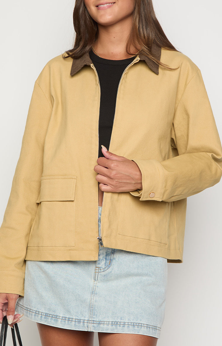 Beginning Boutique Jemma Cream Contrast Canvas Jacket with a brown contrast collar, front zipper, and flap pockets