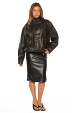 Full length view of a black PU midi skirt with a sleek, fitted silhouette and straight hemline