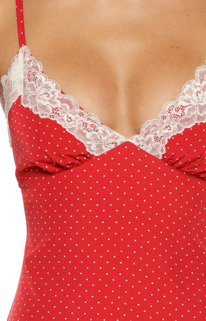 Close-up of the red polka dot mini dress showing the V-neckline with white lace trim and thin spaghetti strap