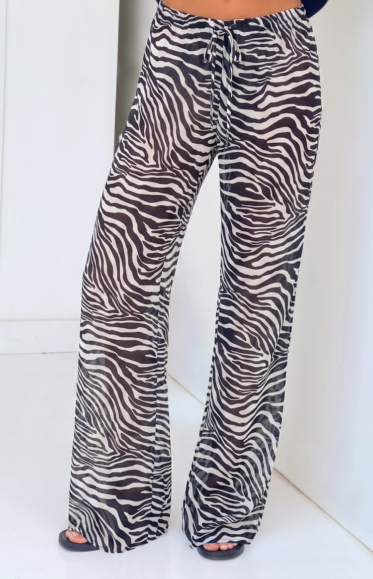Beginning Boutique Joplin Black Sheer Zebra Print Pants black and white zebra print sheer wide-leg pants with a drawstring wa