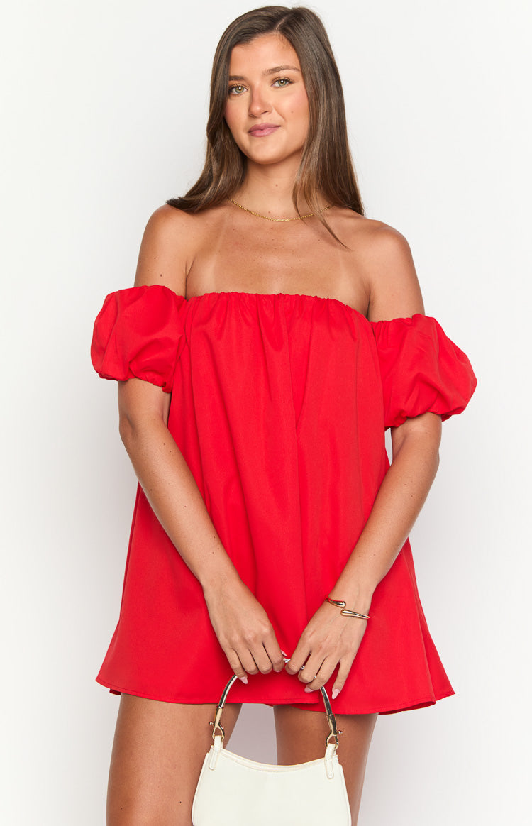 Red off-the-shoulder mini dress with elasticated neckline and short puff sleeves, showing a loose fit