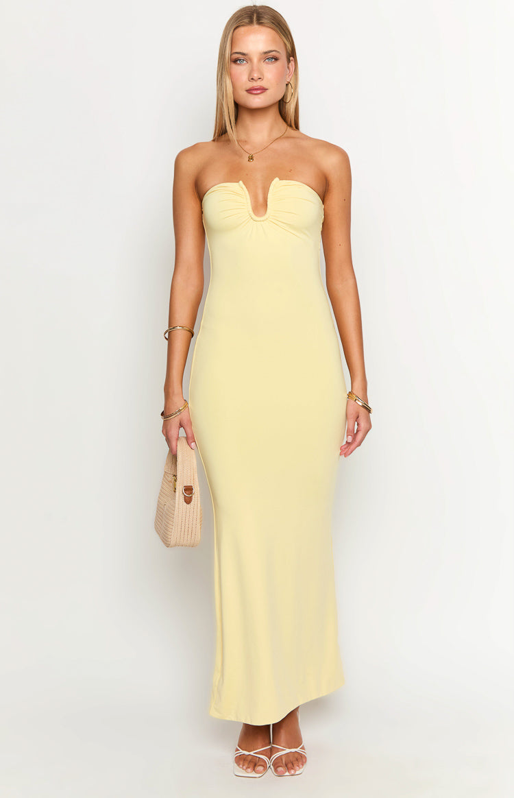 Front view of a yellow strapless maxi dress with a V-notch ruched bust and fitted silhouette