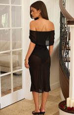 Rear view of a black sheer off-the-shoulder midi dress with a fitted silhouette