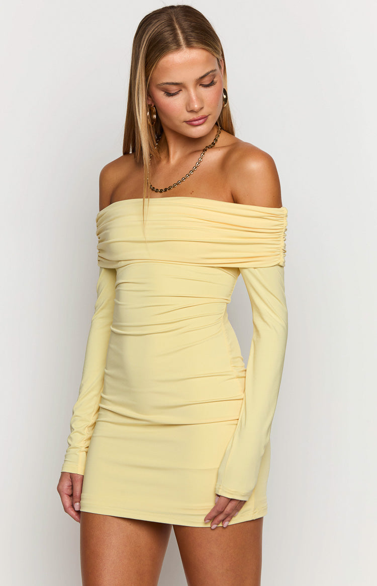 Close-up of the yellow off-shoulder ruched neckline, long sleeves, and ruched bodice of the mini dress