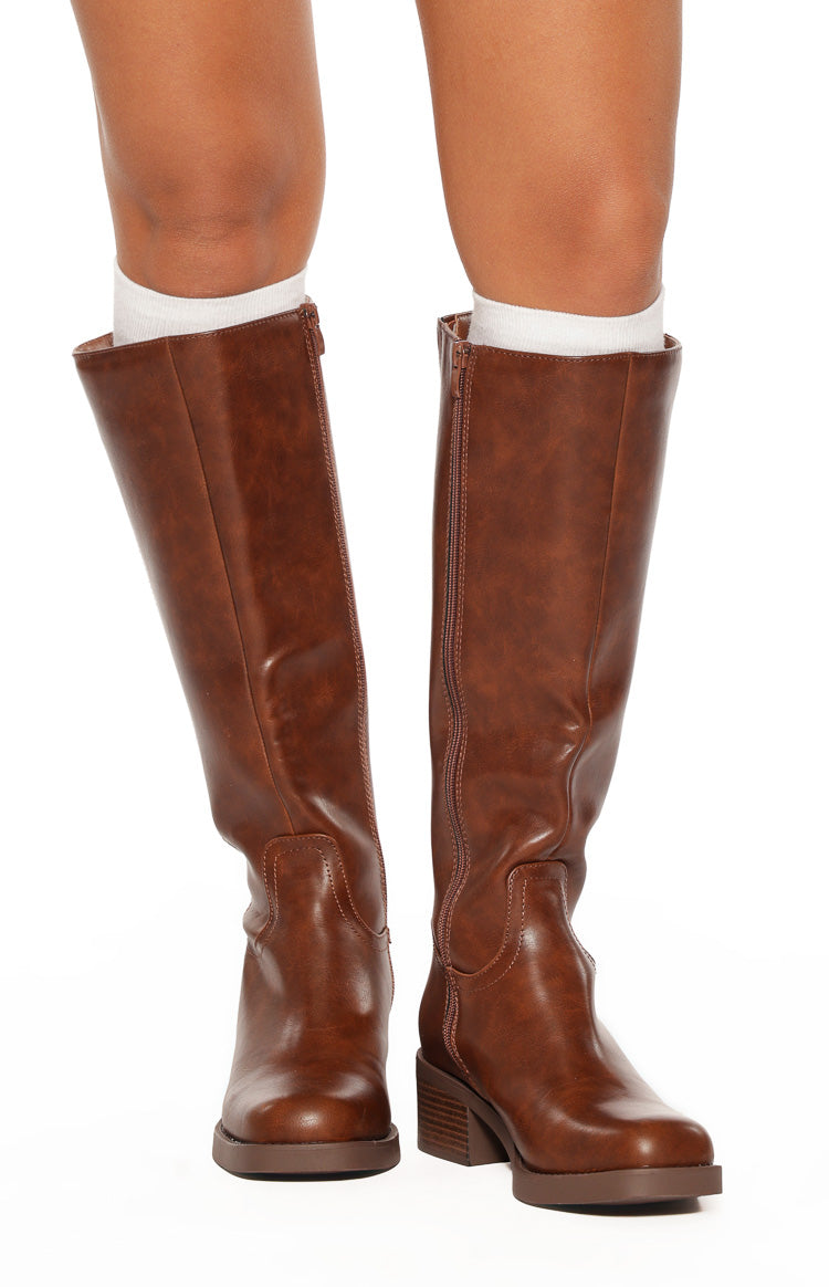 Front view of cognac brown mid-length boots with side zippers, rounded toes, and block heels