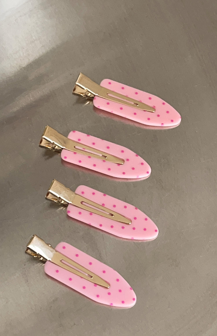 Four pink polka dot non-crease hair clips with gold metal clasps