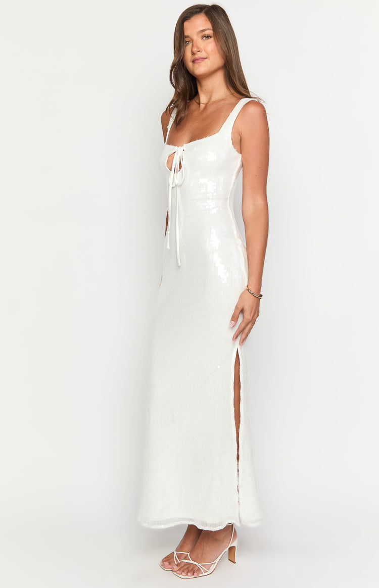 Side view of a white sequin maxi dress with a square neckline, tie-front detail, and a high side slit