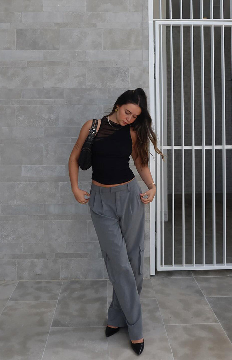 Full length view of grey straight leg pants with pleated waist and cargo pockets