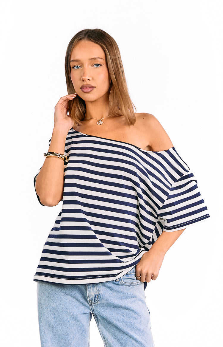 Navy and white striped oversized top with a wide off-shoulder neckline and loose short sleeves