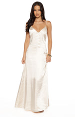 Cream satin maxi dress featuring a deep V-neckline and thin spaghetti straps