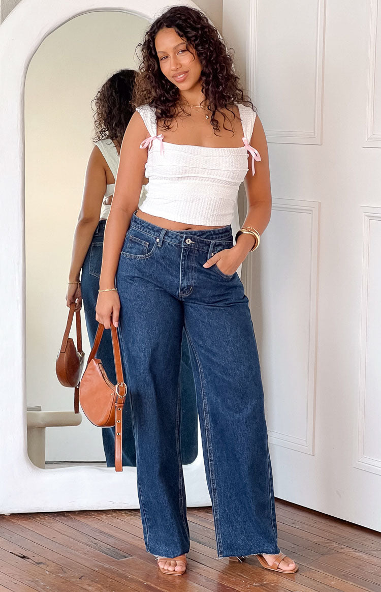 Beginning Boutique Kansis Dark Blue Uneven Waist Jeans dark blue denim wide leg jeans with an uneven high waist