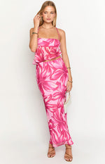 Full front view of a pink maxi skirt with vibrant fuchsia floral print and a flowing fit