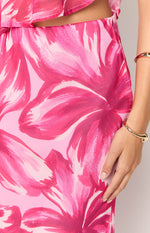 Close-up of the pink floral pattern with fuchsia and light pink brushstrokes on the flowy maxi skirt fabric