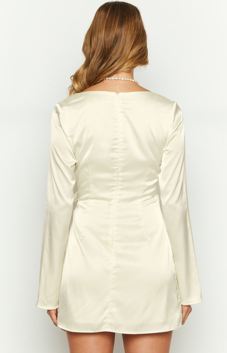 Rear view of a cream satin long sleeve mini dress with a straight back and invisible zipper closure