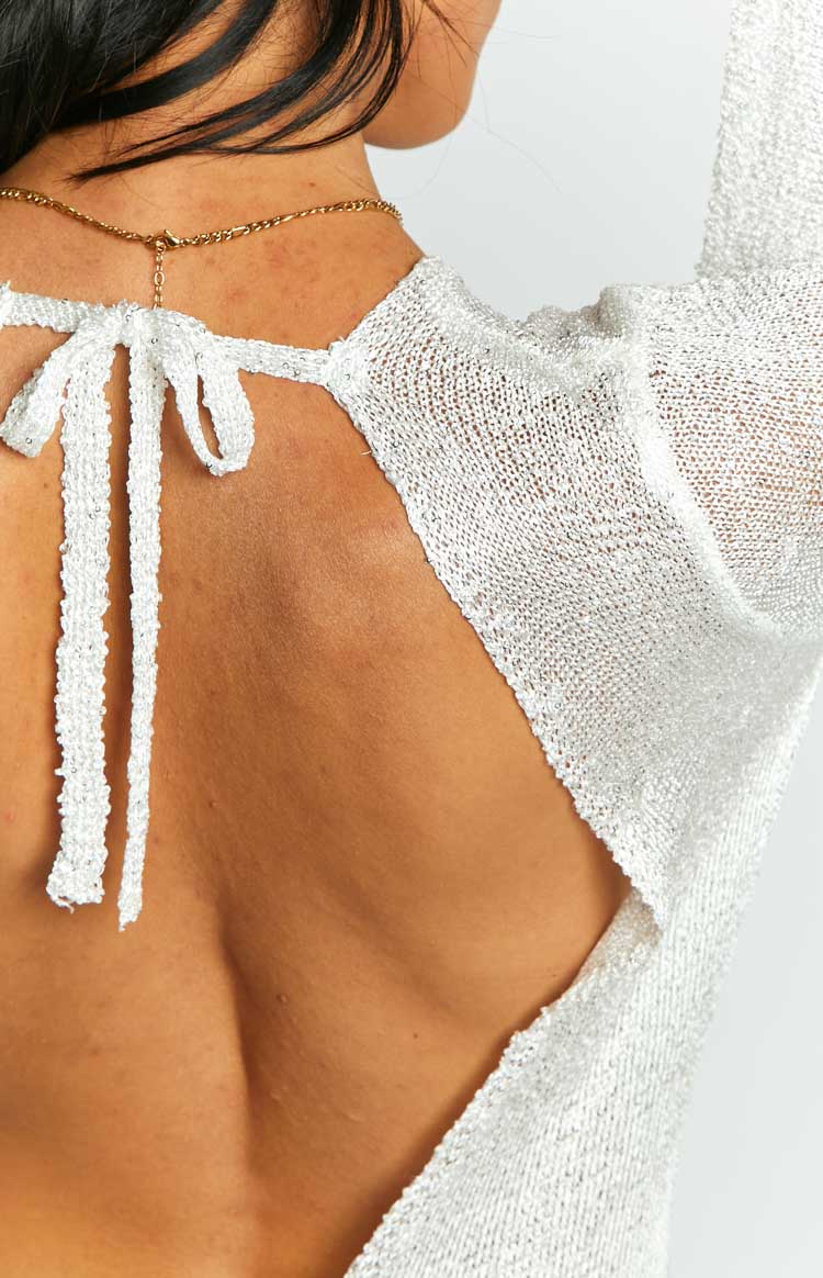 Close-up of the white sequin knit tie-back detail on an open back maxi dress