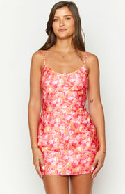 Front view of an orange floral print mini dress with a scoop neckline and thin spaghetti straps