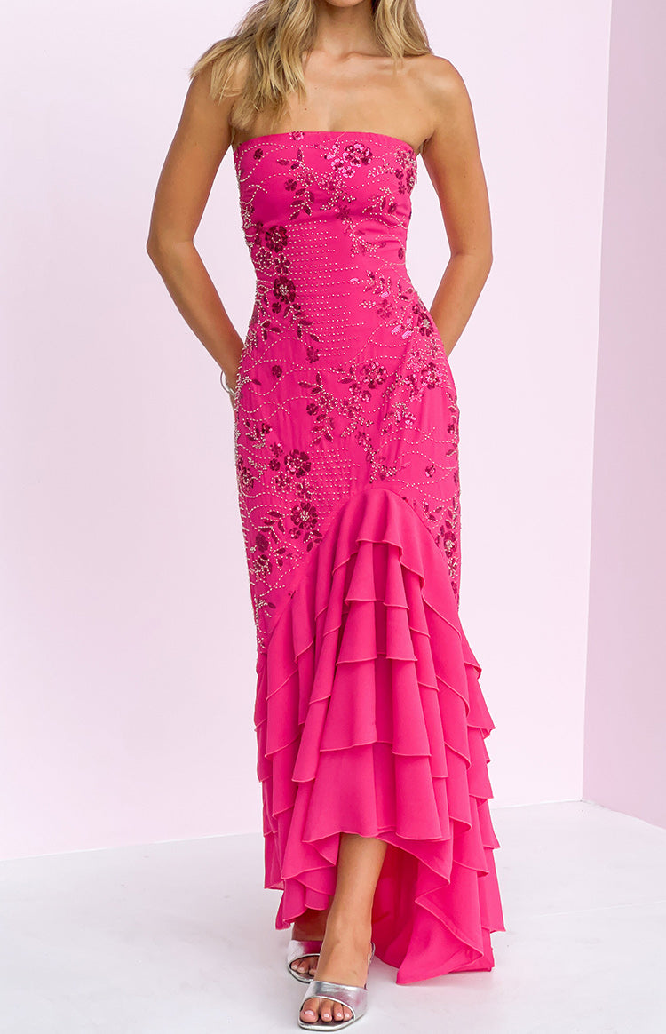 Pink strapless maxi dress with intricate floral beading and a tiered ruffled high-low skirt