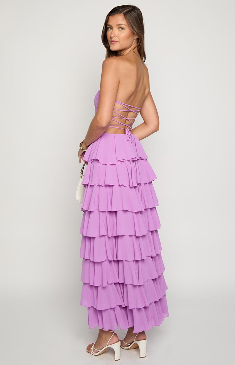 Rear view of a magenta maxi dress with a criss-cross lace-up back and cascading tiered ruffles