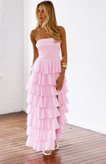Pink strapless maxi dress with a fitted bodice and cascading tiered ruffles down the full skirt