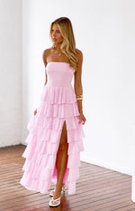 Pink strapless maxi dress with a tiered ruffle skirt and a high side slit
