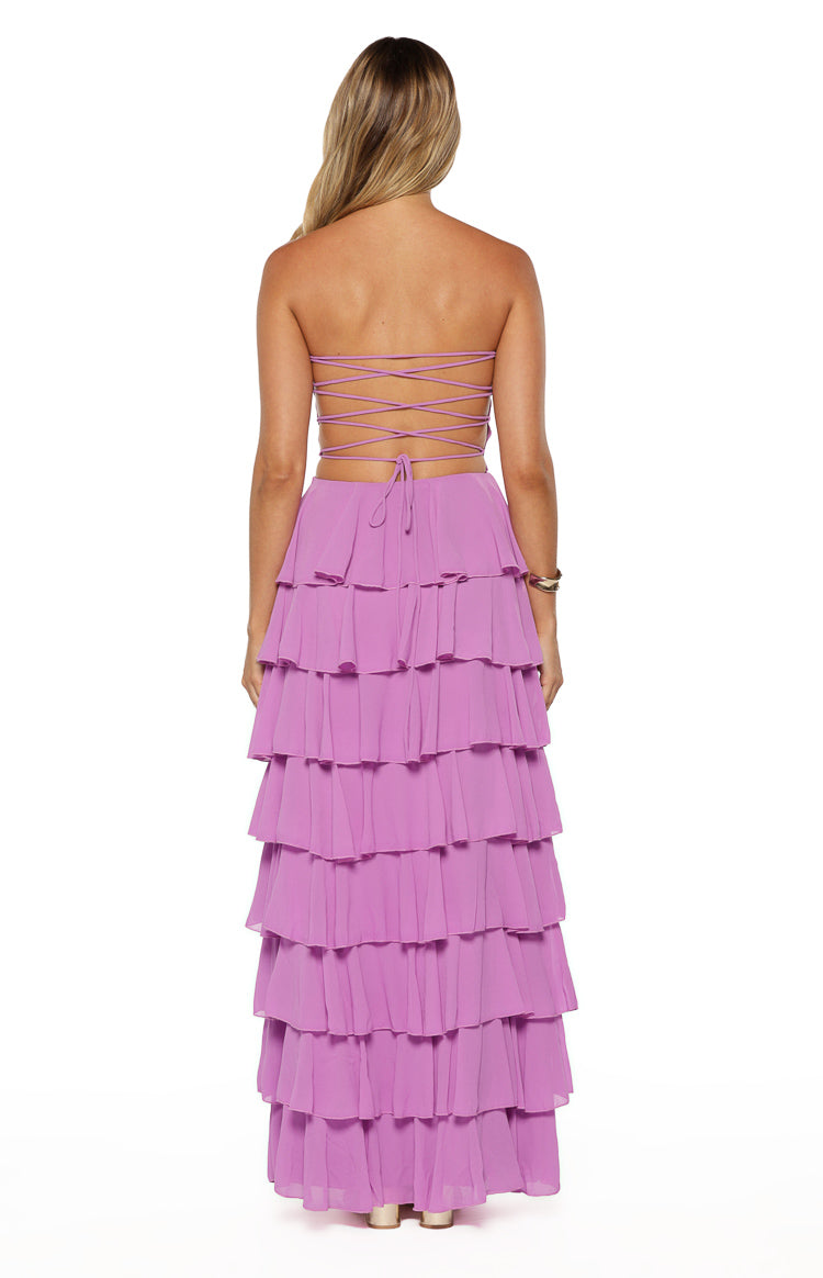 Rear view of a magenta strapless maxi dress with criss-cross lace-up back and tiered ruffle skirt