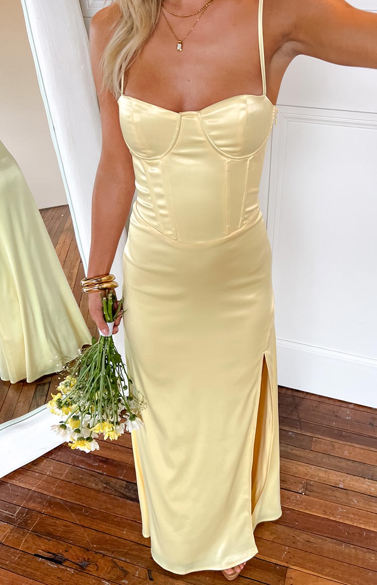 Beginning Boutique Lailani Yellow Corset Maxi Dress pale yellow satin corset maxi dress with spaghetti straps and side slit