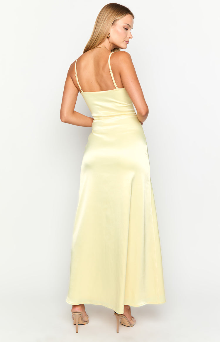 Rear view of a light yellow satin maxi dress with thin adjustable spaghetti straps and a straight backline