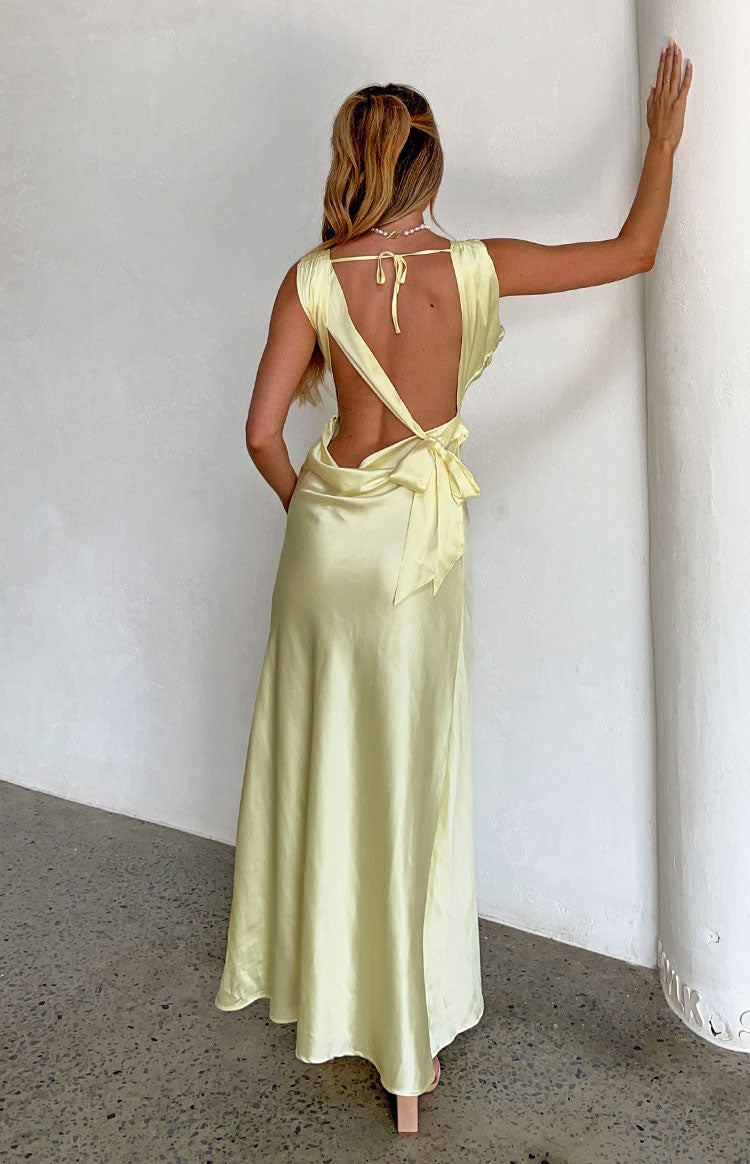 Beginning Boutique Laria Yellow Satin Formal Maxi Dress pale yellow satin backless maxi dress with neck tie and large bow tie at back