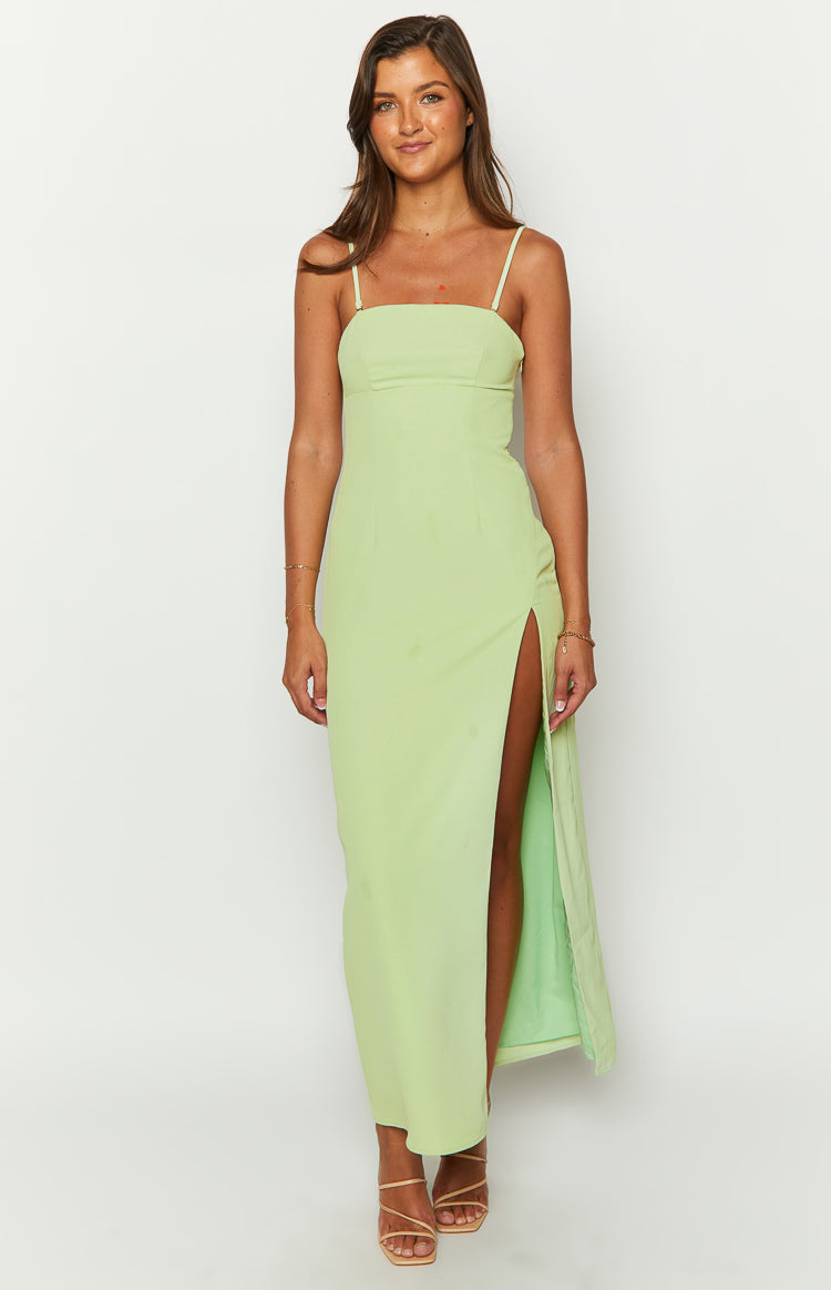 Fitted lime green maxi dress with a square neckline, thin spaghetti straps, and a high leg slit