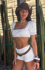 white ruffle shorts with white top with ruffle sleeves