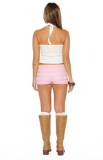 Rear view of pink micro shorts with horizontal ruffled tiers