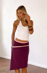 Grape asymmetric midi skirt with pink contrast binding on the waistband and diagonal seam