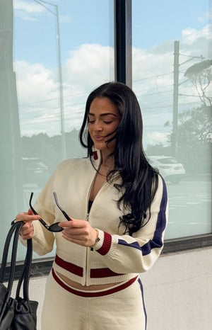 Beginning Boutique Liberty Cream Knit Jacquard Zip Sweater cream knit zip sweater with mock neck, ribbed cuffs, and red and n