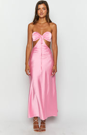 Pink satin strapless maxi dress with a front bow detail and side waist cutouts
