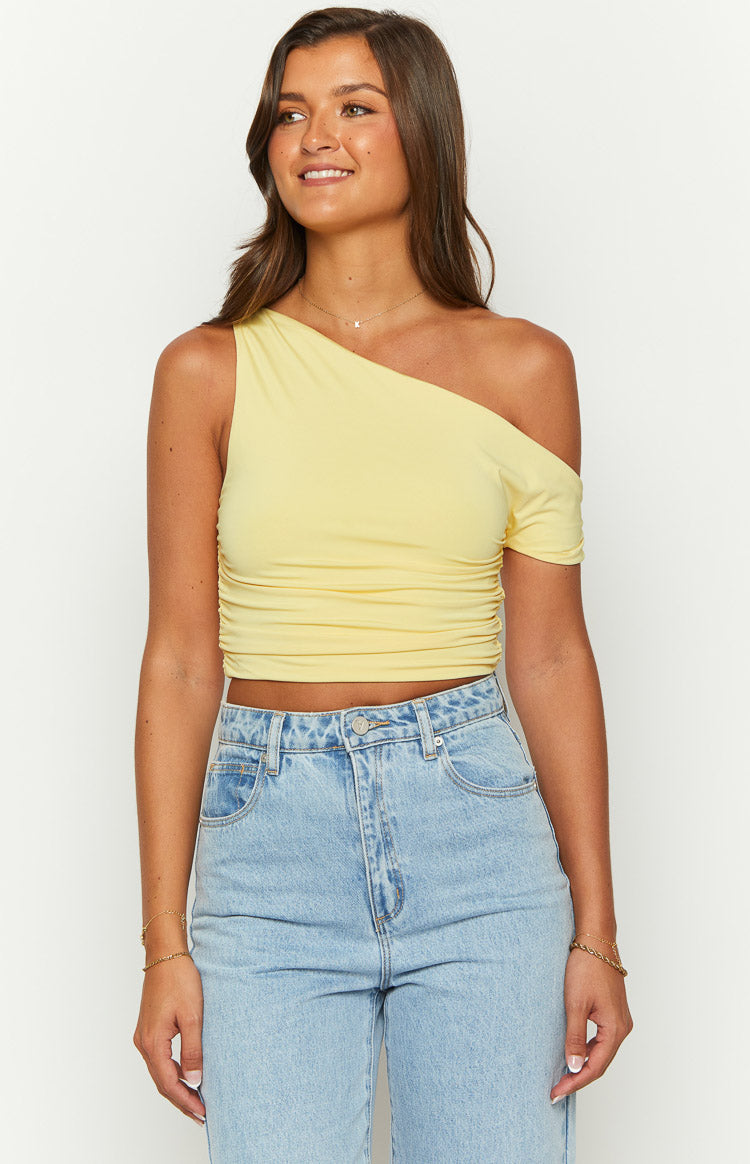 Yellow draped off-shoulder crop top with one short sleeve and ruched side detail