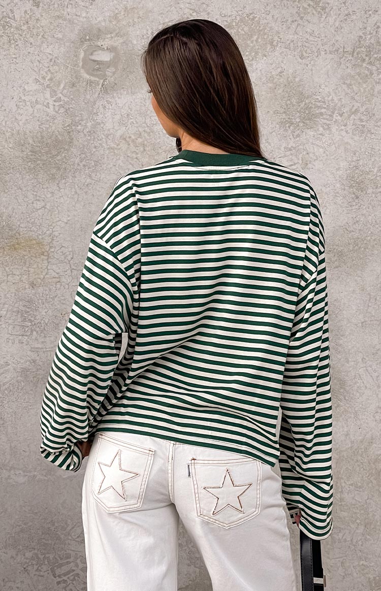 Rear view of a moss green and white striped long sleeve top, showing the ribbed crew neck and relaxed fit