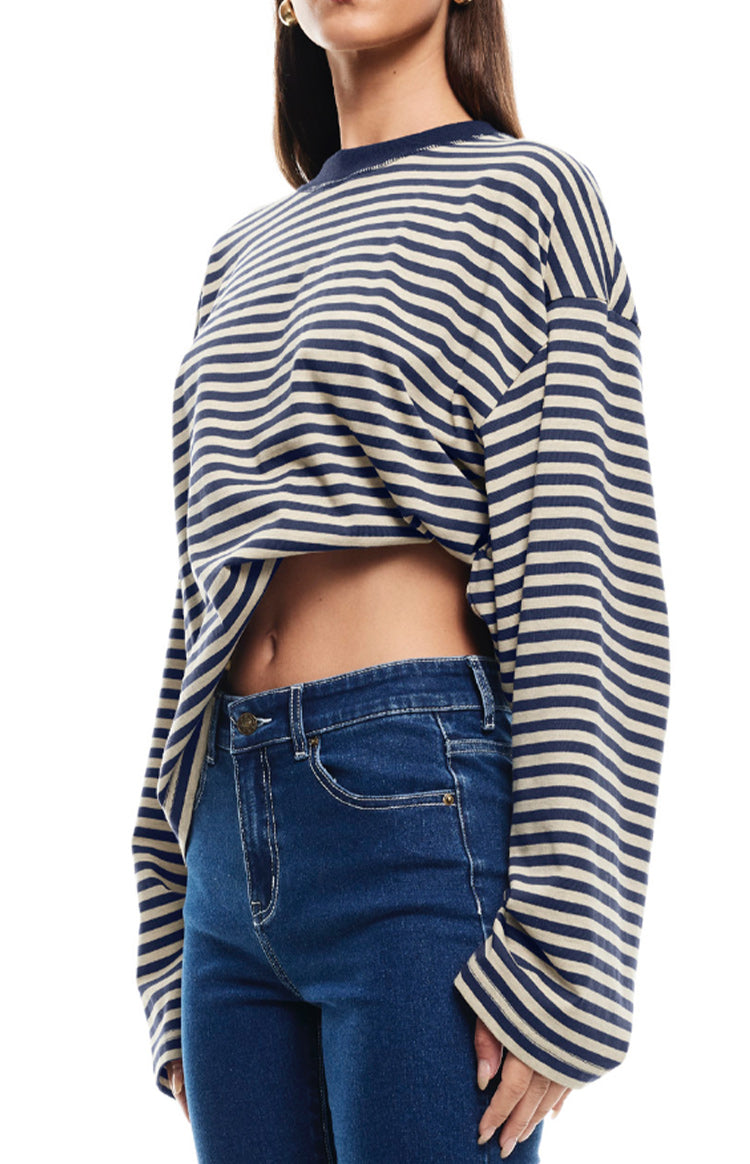 Cropped navy and cream striped long sleeve top with an oversized fit and ribbed crew neck