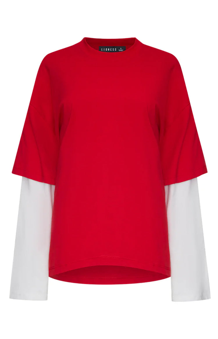 Front view of a crimson red short sleeve shirt layered over a white long sleeve shirt with a mock neck