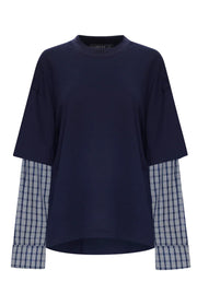 Navy mock neck shirt with short outer sleeves and long blue and white checked layered sleeves with cuffs