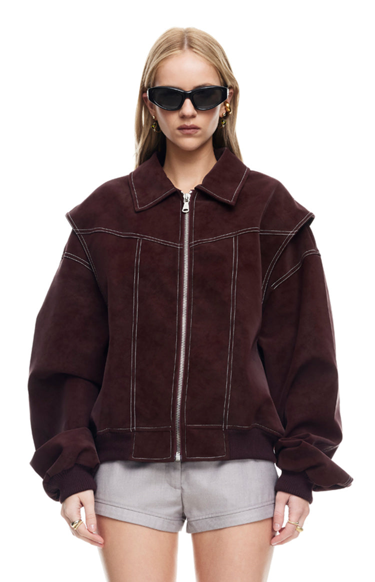 Shiraz bomber jacket with white contrast stitching, wide collar, and layered shoulder detail