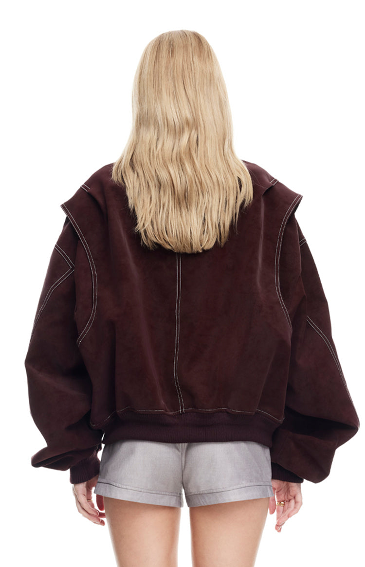 Rear view of a shiraz bomber jacket featuring white contrast stitching, dropped shoulders, and a ribbed hem