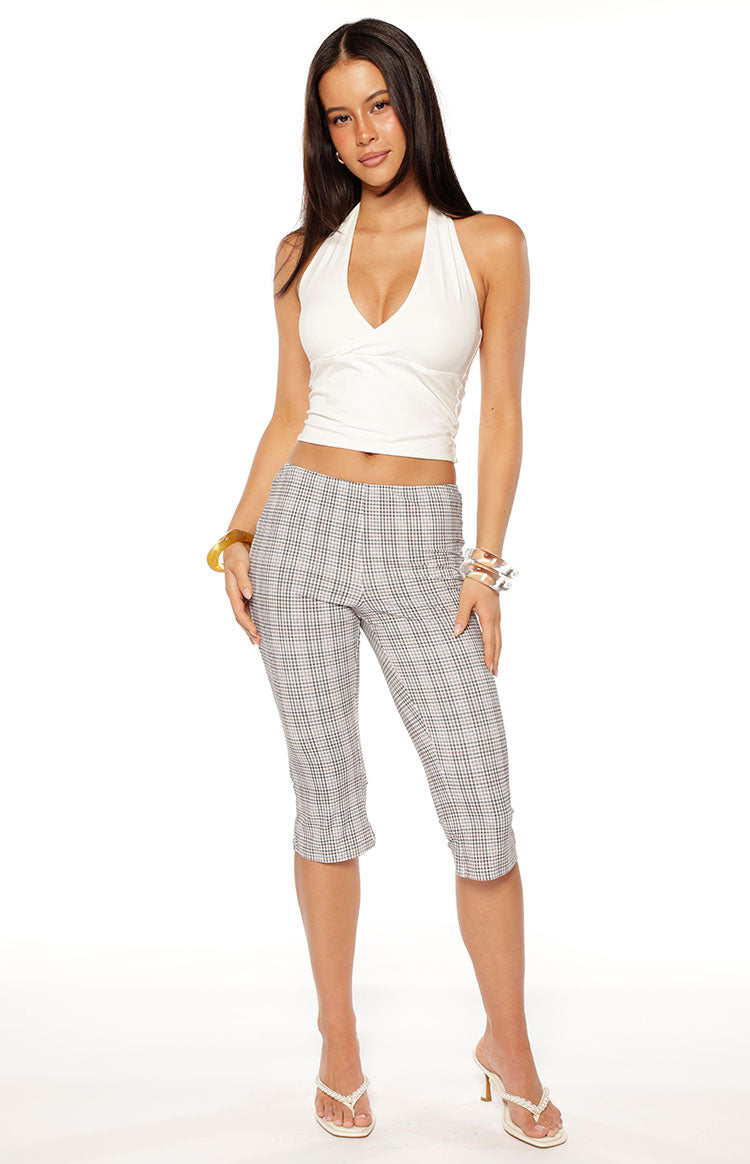 Front view of fitted moonlight plaid capri pants with a cropped length and subtle ruched hem